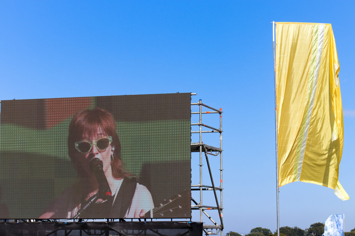 Orla Gartland on the main stage screen at Camp Bestival