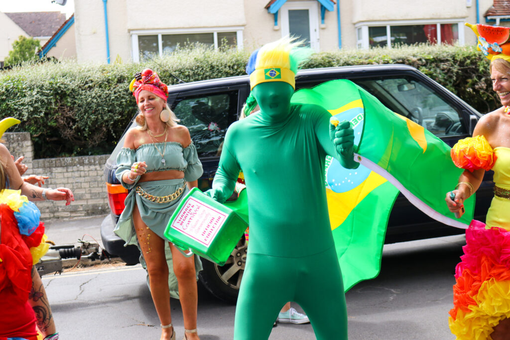 Swanage Carnival green dancing guy