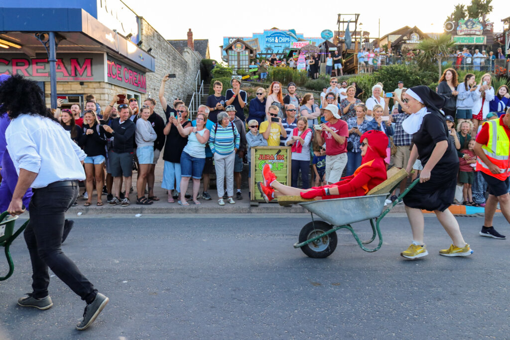 Nun & lobster fancy dress in Swanage Carnival wheelbarrow race