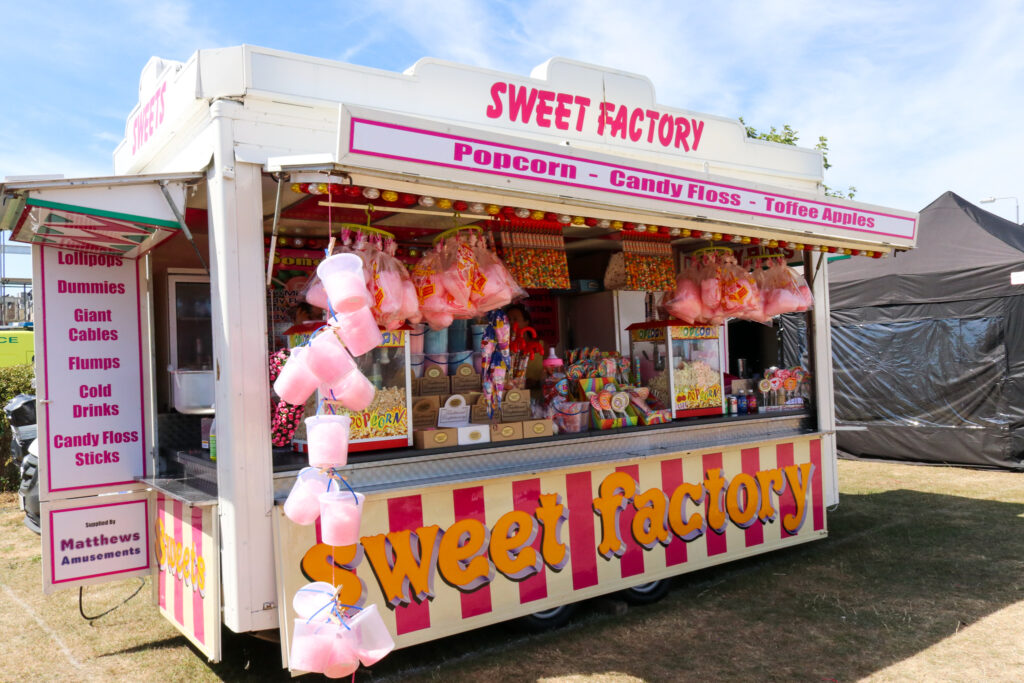 Popcorn, candy floss, toffee apples and sweets for sale at Swanage Carnival