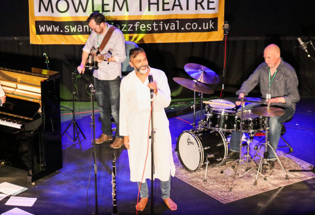 Arun Ghosh and his band on stage at The Mowlem Theatre