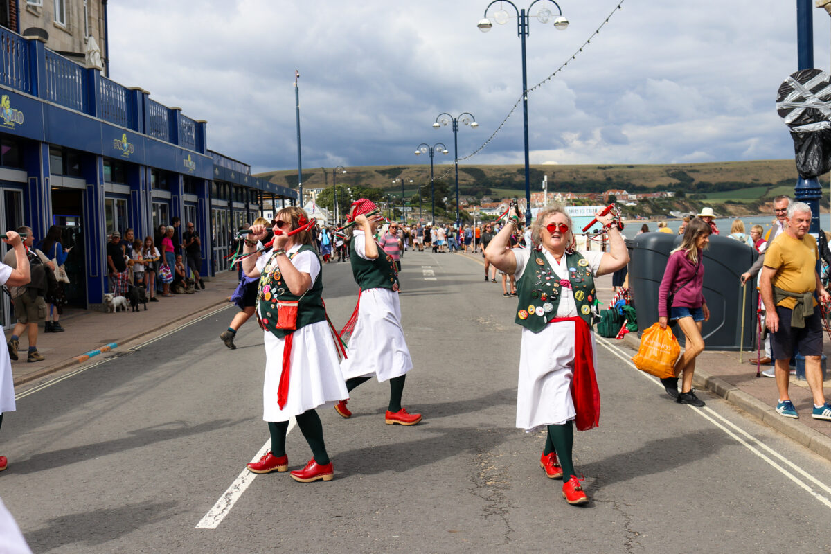 Morris dancers performing on on Shore Road in Swanage
