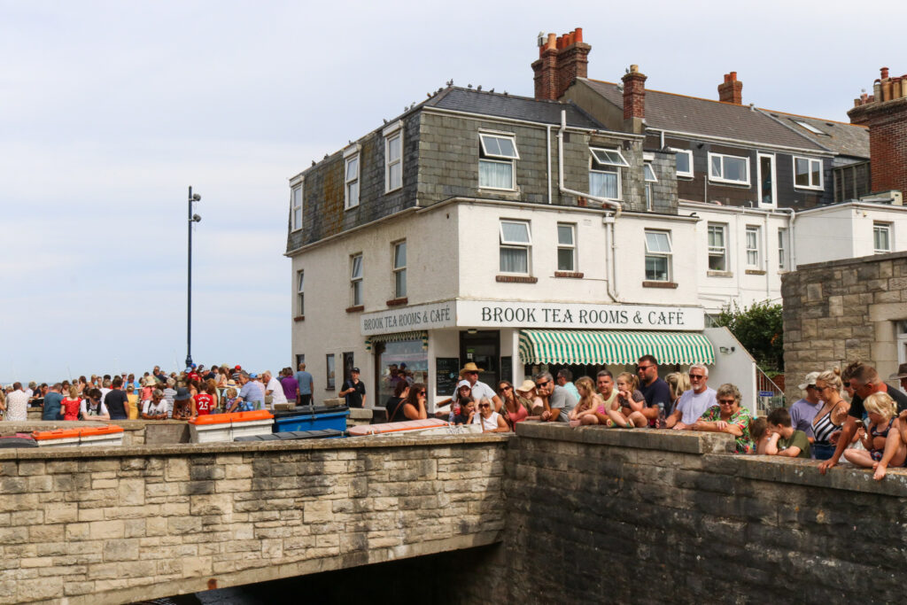 People gathering outside Brook Tea Rooms & Café for the annual RNLI duck race