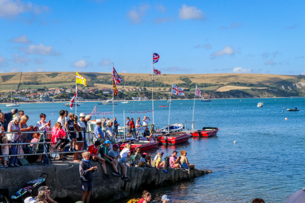 People watching the Swanage Lifeboat Week build-a-boat race