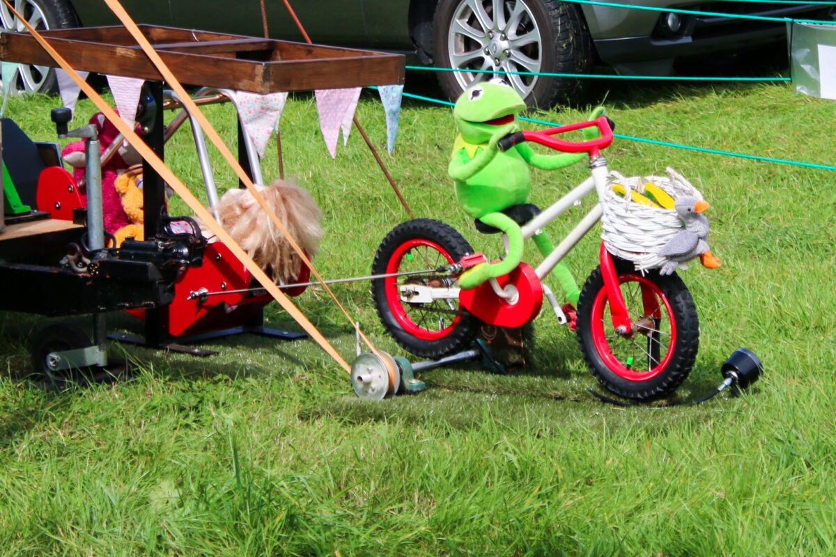 Kermit the Frog on a bicycle