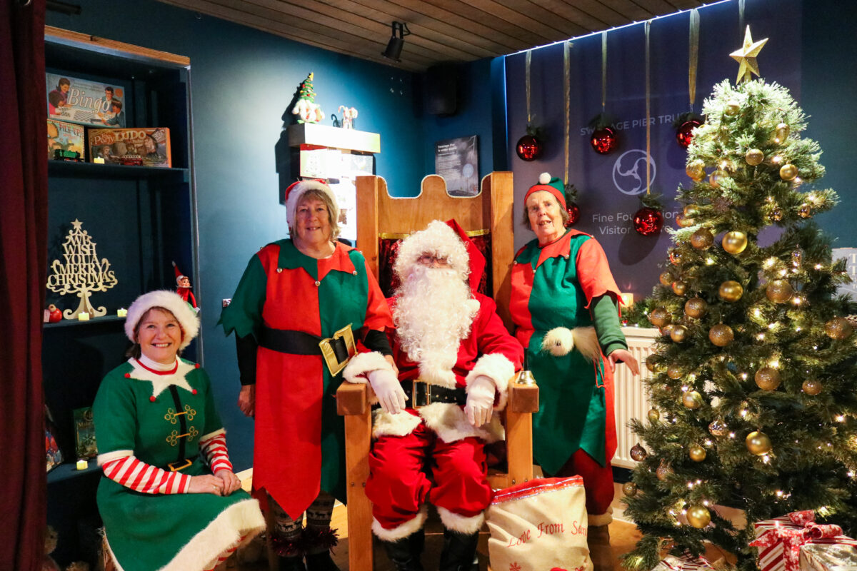 Santa and his elves at the Swanage Pier grotto