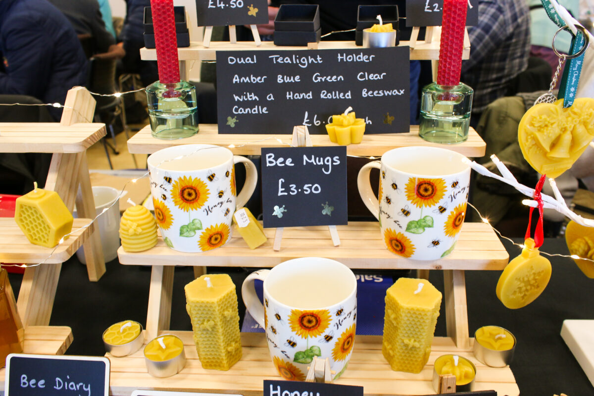 Beeswax candles and honey bee mugs stall