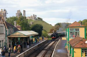 Steam train coming in to Corfe Castle Station